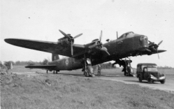Image from the Allan Mason Forbes Alexander personal album. 3/4 front view of a No. 75 Squadron Stirling. Unknown location in England.